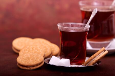 Glass of tea and cookiesの写真素材