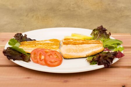 Two pieces of cooked salmon
