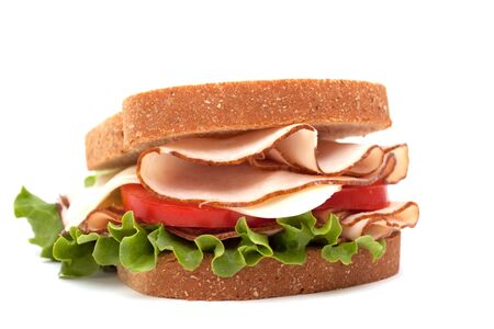 Turkey breast sandwich on wheat bread on white backgroundの写真素材