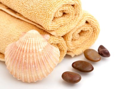 Spa decor with towels, pebbles and seashellの写真素材