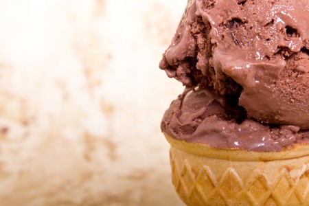 Scoops of chocolate ice cream in ice cream coneの写真素材