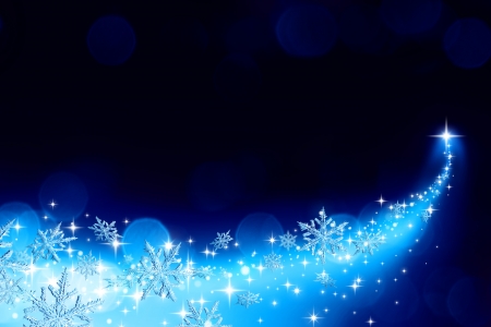 Christmas background with a trail of stardust and snowflakes の写真素材