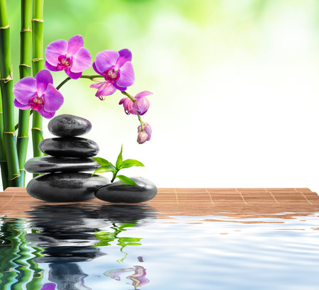 spa with bamboo , orchids and water の写真素材