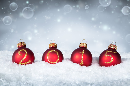 happy new year 2015 - balls on snowの写真素材