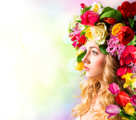 Spring portrait - hat of flowersの写真素材