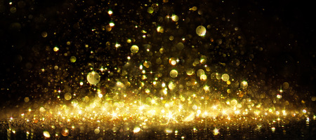 Shimmer Of Golden Glitter On Blackの写真素材