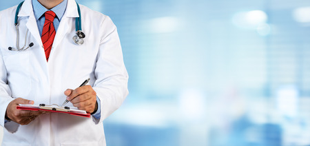 Doctor Writing Prescription - Clinic Blurred Backgroundの写真素材