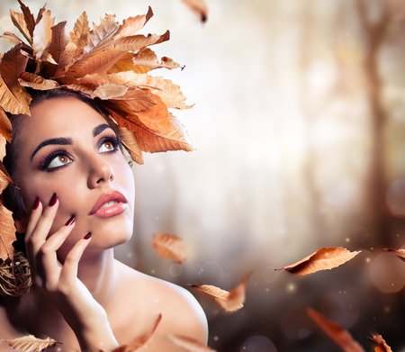 Beauty Fashion Model In Fall Forestの写真素材