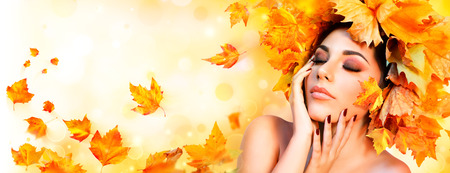 Fall Girl - Beauty Model Woman With Orange Autumn Leaves Hairstyleの写真素材