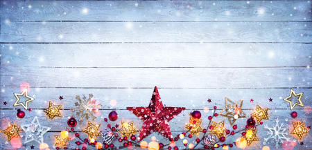 Christmas Border - Stars Decorations On Snowy Plankの写真素材