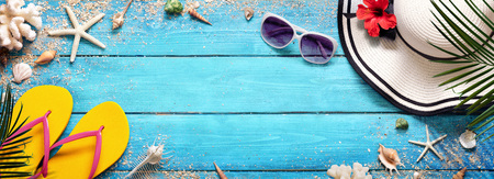 Summer Beach Background - Hat And Sunglasses On Blue Plank With Palm And Shellsの写真素材