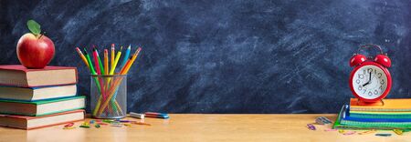 Apple On Stack Books With Pencils And Alarm Clock - Back To Schoolの写真素材