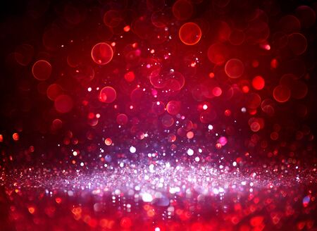 Sparkling Silver Glitter In Red Blurred Backgroundの写真素材