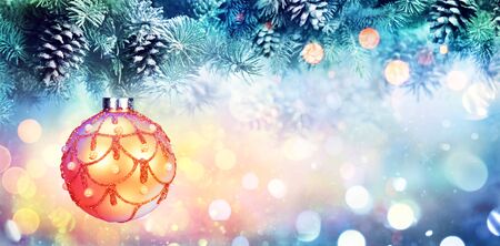 Golden Ball Hanging Fir Branchesの写真素材