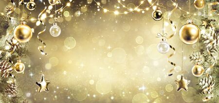 Christmas Background With Vintage Golden Ornament Hanging On Fir Branchesの写真素材