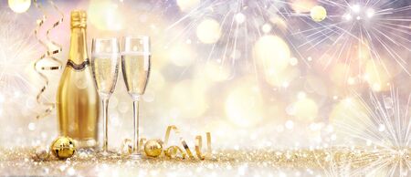 New Year Celebration With Champagne And Fireworks Golden Abstract Backgroundの写真素材