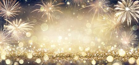 Golden Glitter Background With Fireworks In The Nightの写真素材