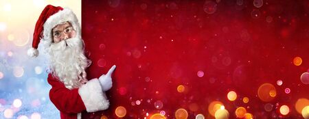 Santa Claus Pointing With Finger On Billboardの写真素材
