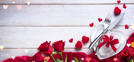 Valentines Day Dinner Romantic Table Setting With Gift And Rosesの写真素材