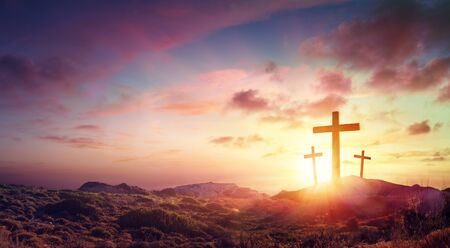 Crucifixion Of Jesus Christ Three Crosses On Hill At Sunsetの写真素材