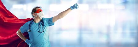 Nurse Wearing Surgical Face Mask In Superhero Cape - Medical Staff During Coronavirus Outbreakの写真素材