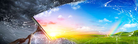 Hand Wiping The Cloudy Sky For A New Better World - Clean Environment Conceptの写真素材