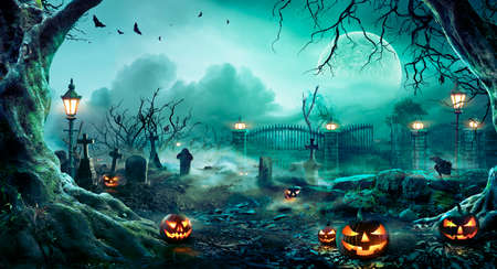 Graveyard At Night - Spooky Cemetery With Moon In Cloudy Sky And Batsの写真素材