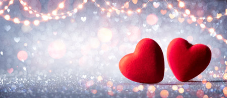 Two Hearts In Love On Silver Glitter With Abstract Defocused Backgroundの写真素材