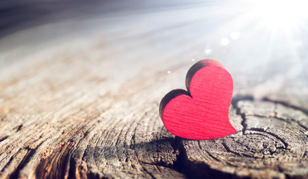 Wooden Heart With Sunlight And Flare Effect In Defocused Background - Valentines Dayの写真素材