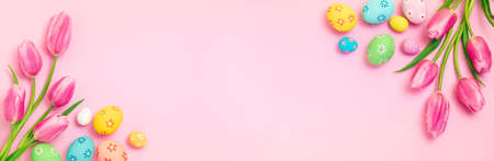 Easter - Decorated Eggs With Tulips On Pink Paper Backgroundの写真素材