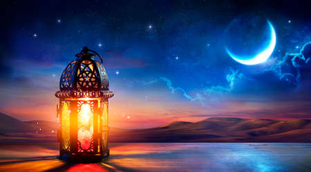 Muslim Holy Month Ramadan Kareem - Ornamental Arabic Lantern With Burning Candle Glowing At Evening - Eid Al Fitrの写真素材