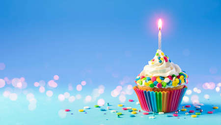 Birthday - Cupcake With Candle And Blue Decorationの写真素材