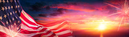 American Flags At Sunset With Fireworks - Abstract Defocused Compositionの写真素材