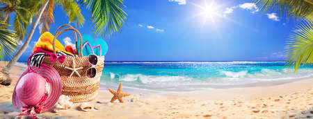 Beach Bag On Tropical Sand With Palm tree and Sunny Seaの写真素材