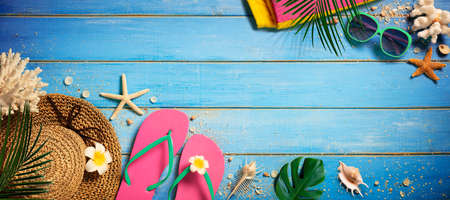 Beach Accessories On Blue Wooden Plank - Vacation Conceptの写真素材