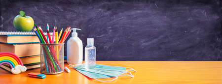 Back To School - Stationery With Covid-19 Protective Mask And Sanitizerの写真素材