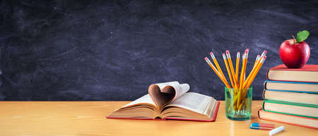 Back To School With Love - Books And Pencils With Apple In Classroomの写真素材