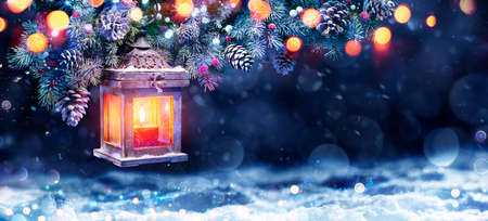 Christmas Lantern In Night With Snow And Fir Branchの写真素材
