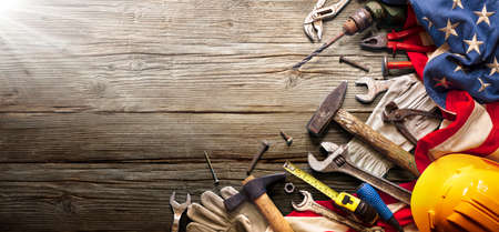 Labor Day - National Holiday - Construction Tools And Usa Flag On Wood Backgroundの写真素材