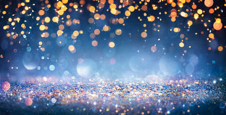 Abstract Christmas Lights On Shiny Glitter In Blue Nightの写真素材