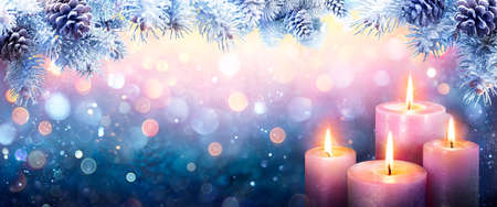 Advent - Four Purple Candles With Fir Branches And Bokeh Lightsの写真素材