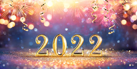 2022 New Year Celebration - Golden Numbers On Glitter With Fireworks And Abstract Defocused Lightsの写真素材