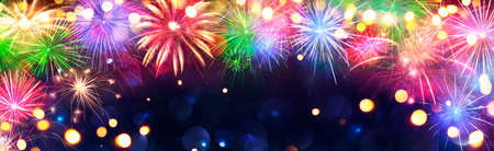 Fireworks - Anniversary Celebration With Colorful Lights In Blue Night With Glittering - Abstract Defocused Bokehの写真素材