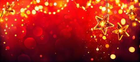 Red Christmas - Golden Stars Lights With Abstract Defocused Glitterの写真素材