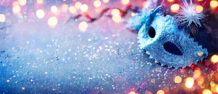 Carnival Mask - Party Masquerade With Abstract Defocused Bokeh Lights On Shiny Confettiの写真素材