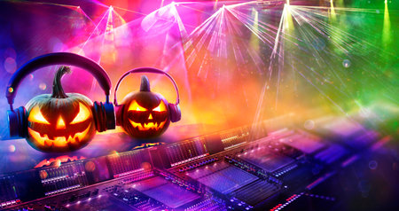 Halloween Disco Music - Pumpkins With Headphones In Nightclub With Confetti And Defocused Abstract Lightsの写真素材