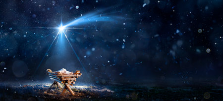 Nativity Scene - Birth Of Jesus Christ With Manger In Snowy Night And Starry Sky - Abstract Defocused Backgroundの写真素材