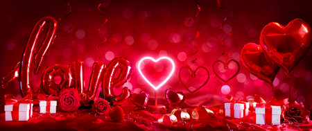 Valentines Day Present And Love - Red Decorations With Gift And Red Balloons In Abstract Defocused Backgroundの写真素材