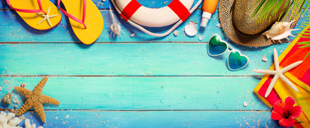 Beach Summer Background - Accessories Hat And Towel With Sandalsand Sunglasses On Blue Wooden plankの写真素材