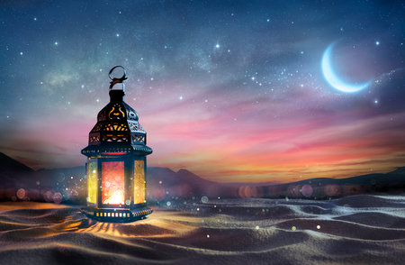 Ramadan Kareem - Arabic Lantern At Dawn In Desert With Crescent Moon - Magic Abstract Glitter In The Lightの写真素材